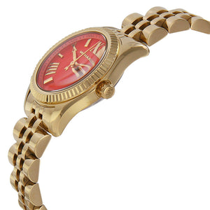 Angled real-life photo of Michael Kors MK3284 showing the coin-edge bezel and gold bracelet detail