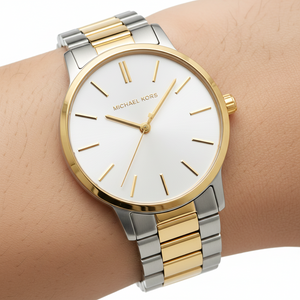 Extreme close-up of Michael Kors MK3198 white dial and gold stick indices