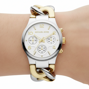 Extreme close-up of Michael Kors MK3199 bracelet showing twisted silver and gold links