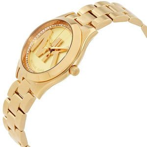 Angled front view of Michael Kors MK3477 showing gold dial sheen and crystals