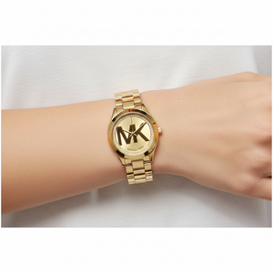 Petite elegance: Woman wearing Michael Kors MK3477 mini gold watch on hairless wrist