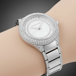 Close-up of Michael Kors MK4657 silver crystal bezel and mother of pearl dial