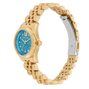 Angled view of Michael Kors MK4813 highlighting the gold-tone fluted bezel and turquoise stone look