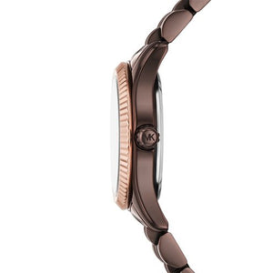 Detailed side view of the rose gold-tone crown and brown case finish on the Michael Kors women's watch