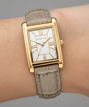 Close-up of Michael Kors MK4964 silver-white sunray dial and gold-tone indices