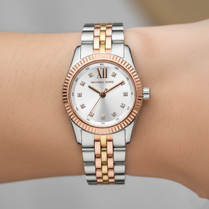 Close-up of Michael Kors MK4987 silver dial with crystal markers and rose gold bezel