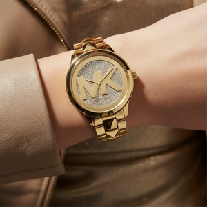 Extreme close-up of Michael Kors MK6714 showing studded bracelet links and crystal dial