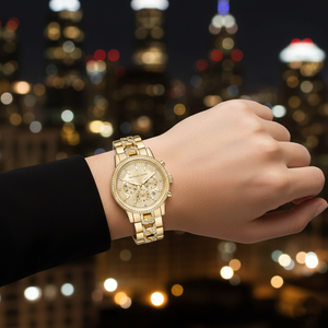 Glamorous woman wearing Michael Kors MK6937 gold pave watch on smooth hairless wrist