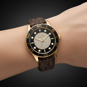 Extreme close-up of Michael Kors MK6979 showing pave crystal dial and black diver bezel
