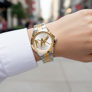 Chic woman wearing Michael Kors MK7319 two-tone logo watch on smooth hairless wrist