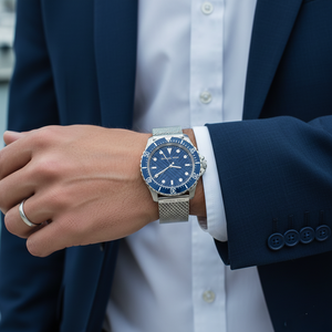 Modern style man wearing Michael Kors MK9082 silver mesh watch on hairless wrist