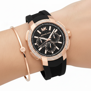 Close up of the MK7245 black dial with embossed MK logo pattern and rose gold-tone multi-function sub-dials