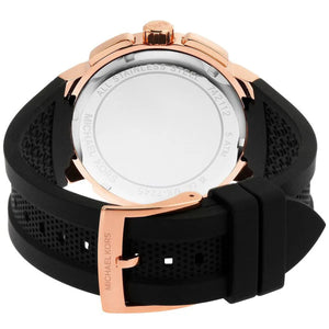 Rose gold-tone stainless steel pin buckle with engraved Michael Kors logo on the black rubber strap