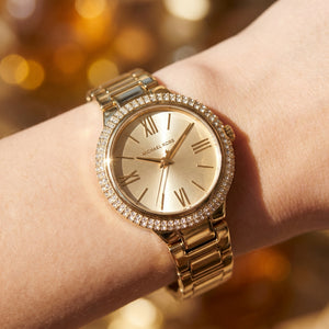 Close up shot of Michael Kors mk4459 on wrist showing gold dial and Roman numerals