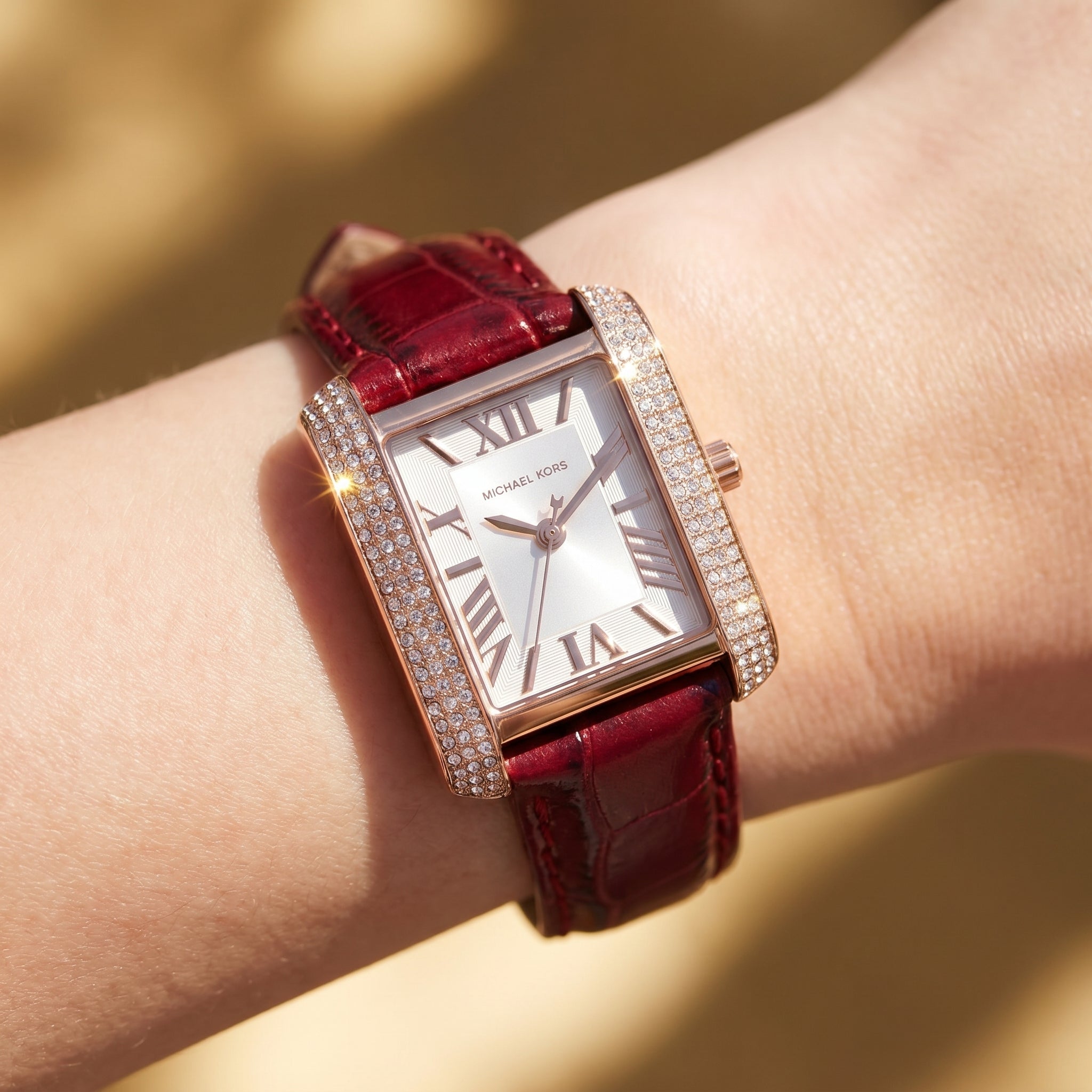Close up shot of Michael Kors MK4689 on wrist showing white dial and rose gold numerals