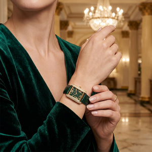 Female model wearing Michael Kors MK4697 green leather watch for a sophisticated luxury look