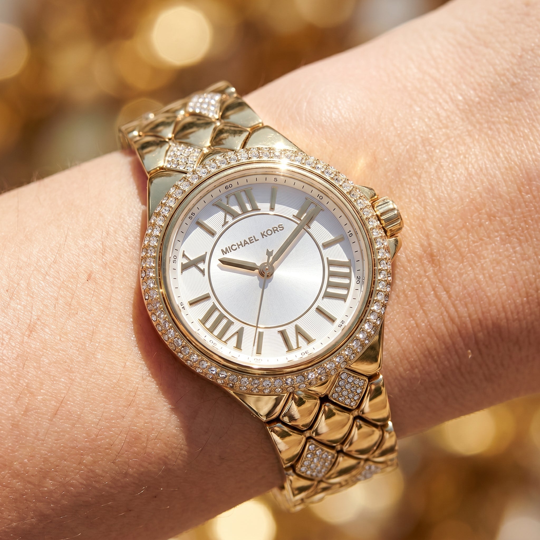 Close up shot of Michael Kors MK4801 on wrist showing silver-white dial and dual-row crystal bezel