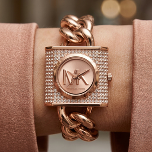 Close up of Michael Kors Camille MK4827 on wrist showing full pavé crystal dial and oversized rose gold chain bracelet