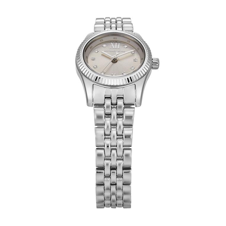 Angled real-life photo of Michael Kors MK4843 showing the polished silver case and fluted detail