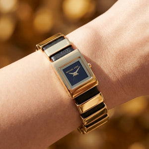 Close up shot of MK4887 highlighting the minimalist black dial and gold square case