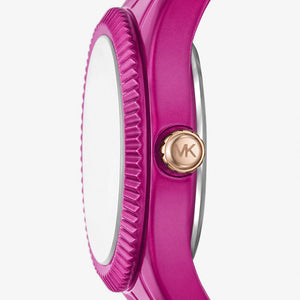 Angled real-life photo of Michael Kors MK4915LE showing the textured bezel and fuchsia case