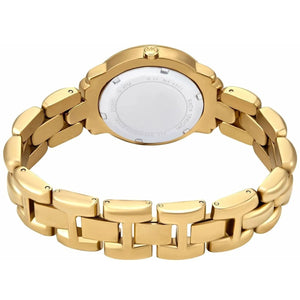 Left side perspective showing the polished gold finish of the unique scalloped case