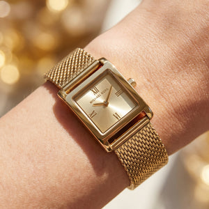 Close up shot of Michael Kors MK4959 on wrist showing gold dial and Roman numerals