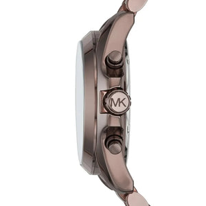 Close-up of a Michael Kors watch with rose gold accents on a white background