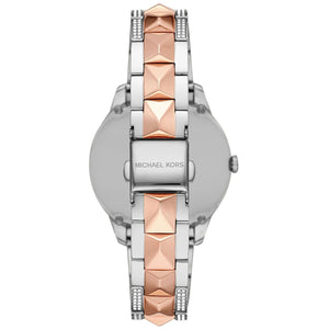 Caseback of Michael Kors Runway Mercer MK6716 women's quartz battery watch showing technical specs pavé dial and two-tone metal bracelet
