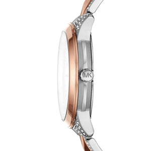 Detailed view of silver-tone crown on Michael Kors Runway Mercer MK6716 women's quartz battery watch with pavé dial and two-tone bracelet