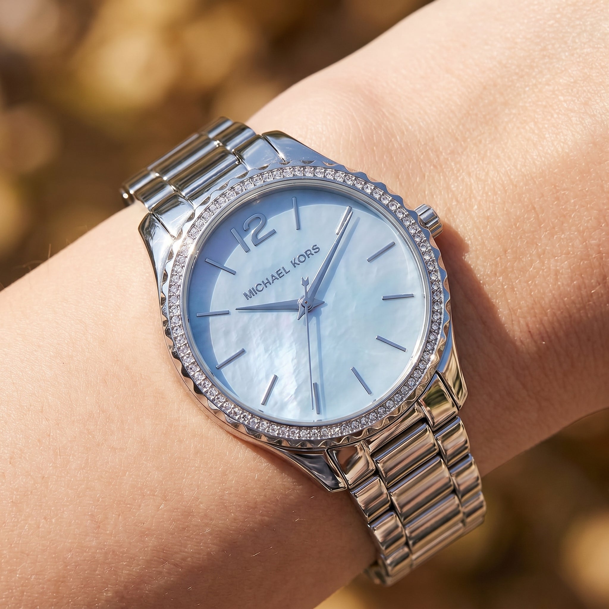 Close up shot of Michael Kors MK6847 on wrist showing light blue mother of pearl dial