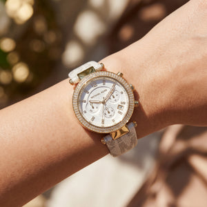 Close up shot of Michael Kors MK6916 on wrist showing white dial and dual-row crystal bezel