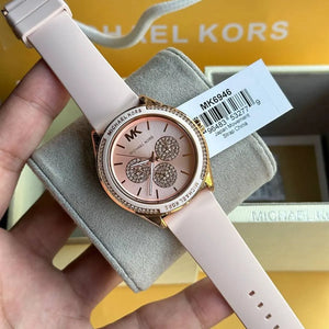 Detailed view of the soft and durable pink rubber silicone strap for the Michael Kors Jessa watch