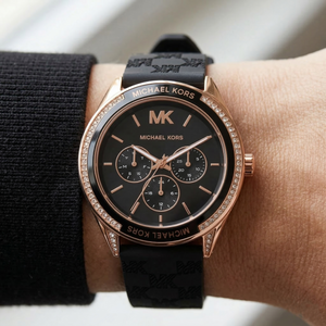 Close up of Michael Kors Jessa MK7266 women's quartz battery watch on wrist showing black multi-function dial and crystal bezel