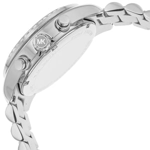Detailed view of silver-tone crown and pushers on Michael Kors Lexington MK7277 women's quartz battery watch with blue dial