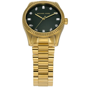 Angled real-life photo of Michael Kors MK7449 showing the polished fluted bezel and green dial