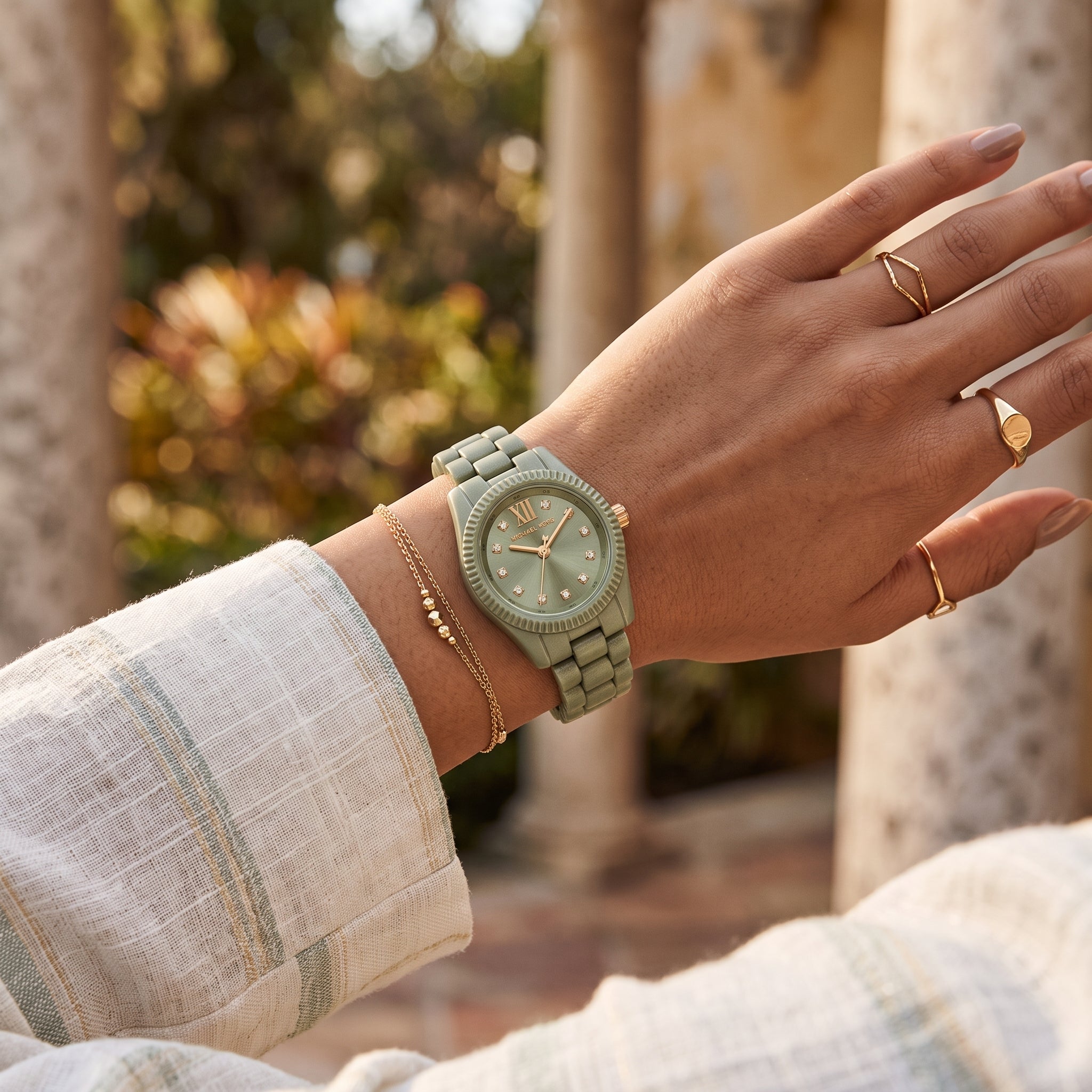Michael Kors Lexington Green MK7517LE women's watch worn on the wrist.