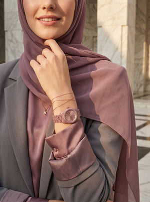 Lifestyle photo of Michael Kors MK7518LE showing the elegant rose watch on a woman's wrist