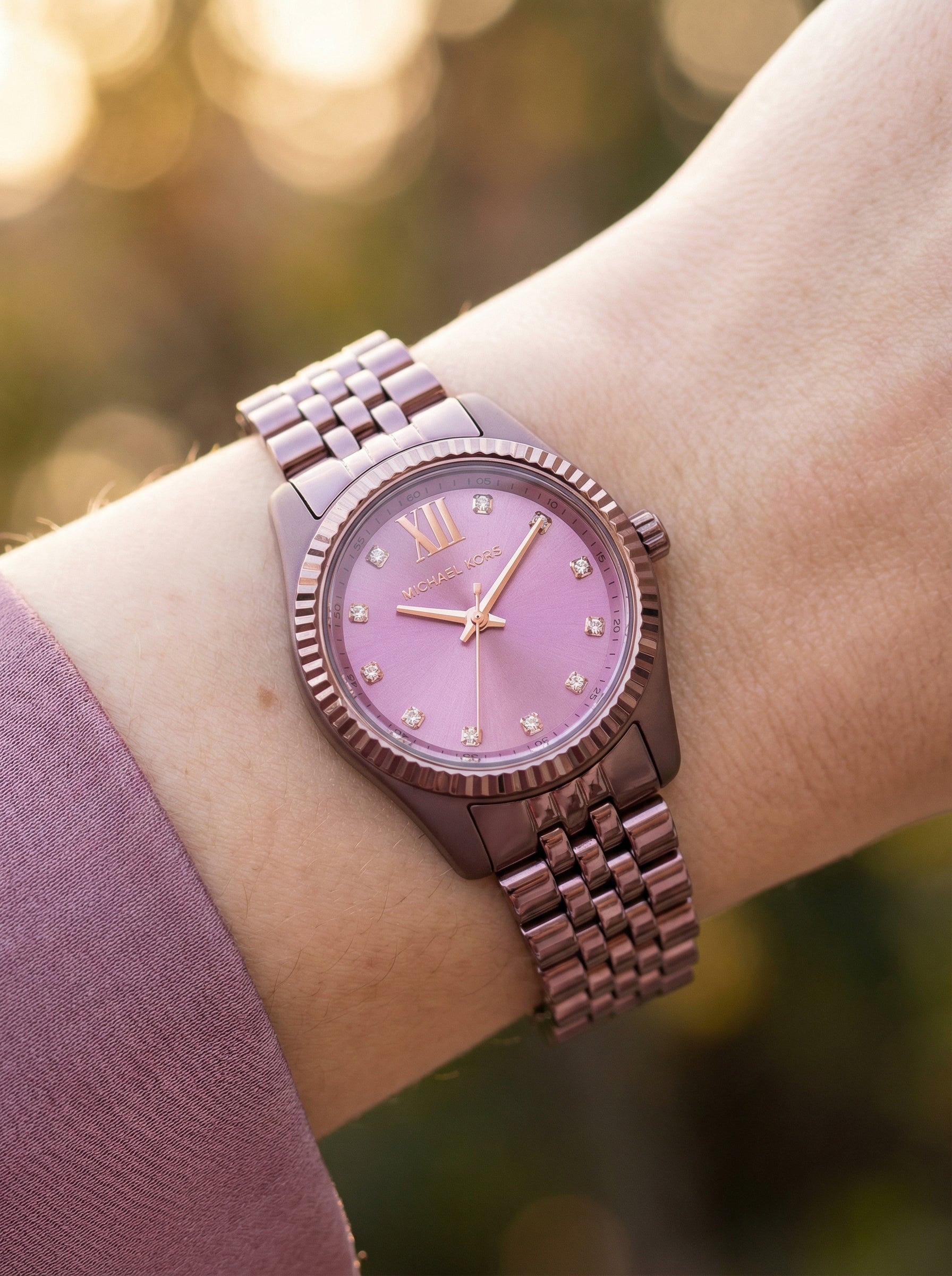 Close up shot of Michael Kors MK7518LE on wrist showing petite 26mm case and rose dial