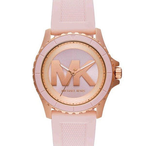 MK7536 Michael Kors analog watch with a light pink textured silicone strap, a rose gold-tone case, and a matching rose gold dial featuring a large 'MK' logo.