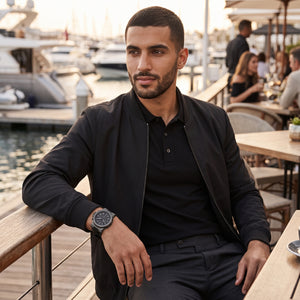 Luxury lifestyle image featuring the Michael Kors Dylan MK8152 men's chronograph watch.