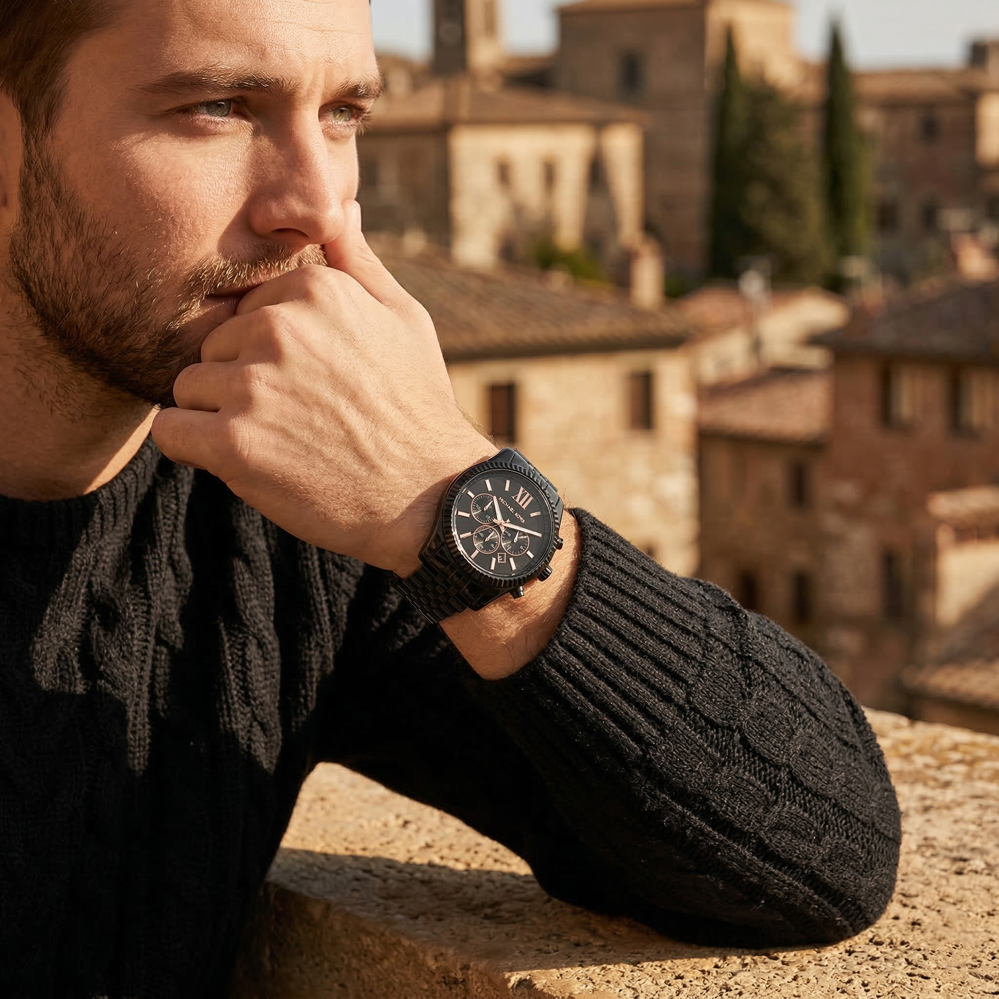 Elegant man wearing Michael Kors Lexington MK8467 men's quartz battery watch with black-tone case and luxury coin-edge bezel