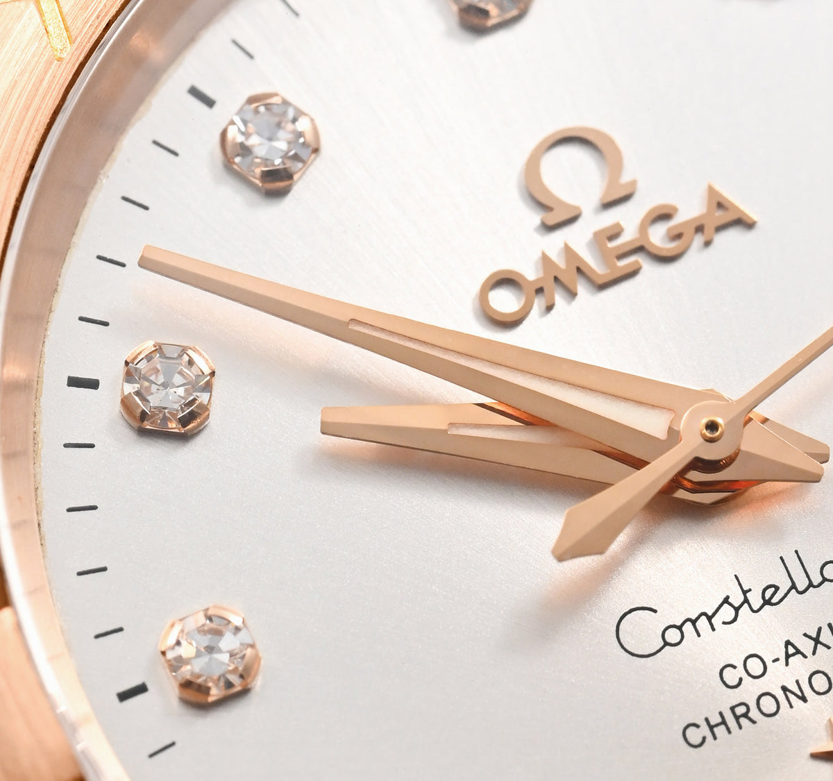 Omega Constellation 123.20.38.21.52.001 men's automatic watch, 38mm two-tone stainless steel and rose gold-tone case, silver dial, Roman numeral bezel, two-tone rose gold bracelet – dial close-up
