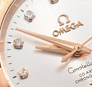 Omega Constellation 123.20.38.21.52.001 men's automatic watch, 38mm two-tone stainless steel and rose gold-tone case, silver dial, Roman numeral bezel, two-tone rose gold bracelet – dial close-up