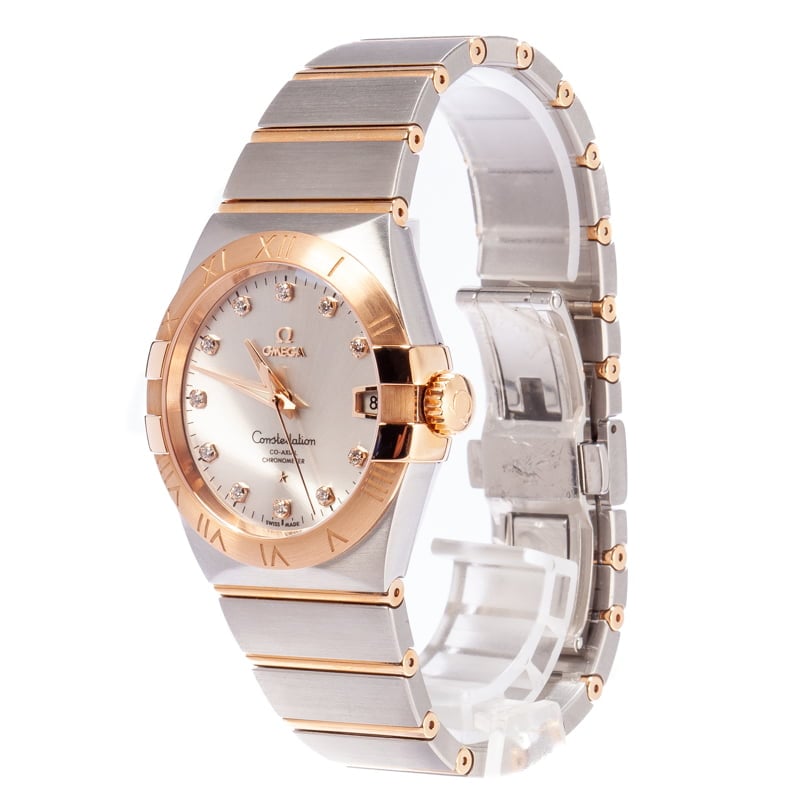 Omega Constellation 123.20.38.21.52.001 men's automatic watch, 38mm two-tone stainless steel and rose gold-tone case, silver dial, Roman numeral bezel, two-tone rose gold bracelet – side angle view