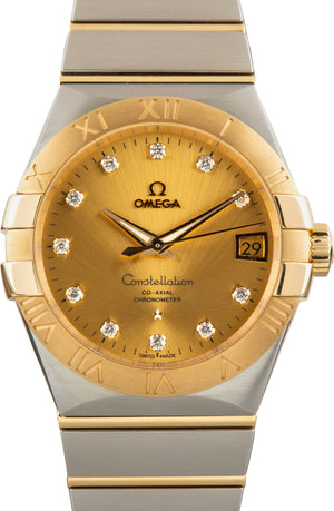 Omega Constellation 123.20.38.21.58.001 men's automatic watch, 38mm two-tone stainless steel and yellow gold-tone case, champagne Supernova dial, Roman numeral bezel, two-tone gold bracelet – front close-up view