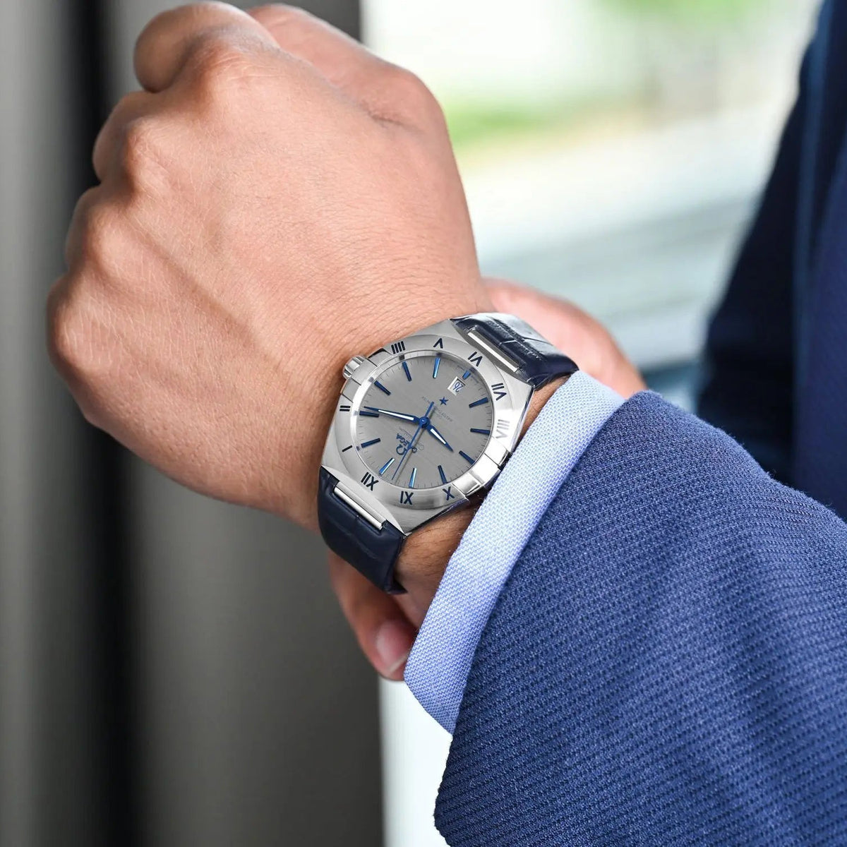 Omega Constellation 131.13.39.20.06.002 men's automatic watch, 39mm stainless steel case, grey dial, blue leather strap – on wrist view