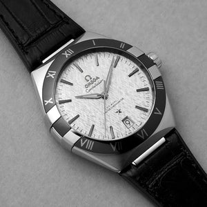 Omega Constellation 131.33.41.21.06.001 men's automatic watch, 41mm stainless steel case, grey dial, black leather strap – dial angle close-up