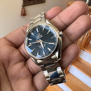 Omega Seamaster Aqua Terra 150M 231.10.42.21.03.003 men's automatic watch, 41.5mm stainless steel case, blue dial, steel bracelet – hand-held view