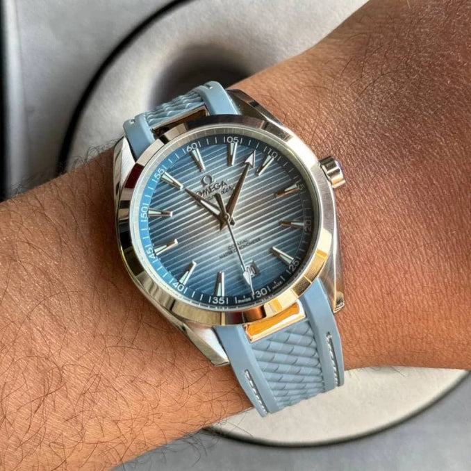 Omega Seamaster Aqua Terra men's automatic watch, 41mm stainless steel case, ice blue dial, light blue rubber strap – on wrist view